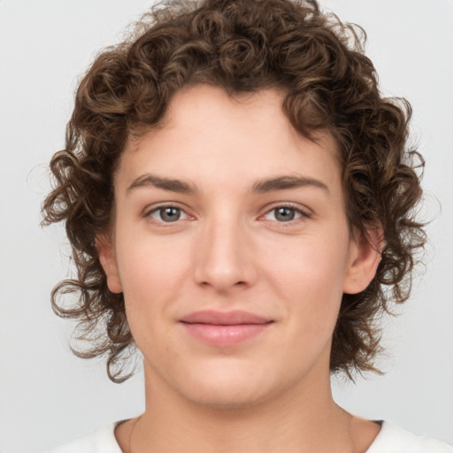 Joyful white young-adult female with medium  brown hair and green eyes