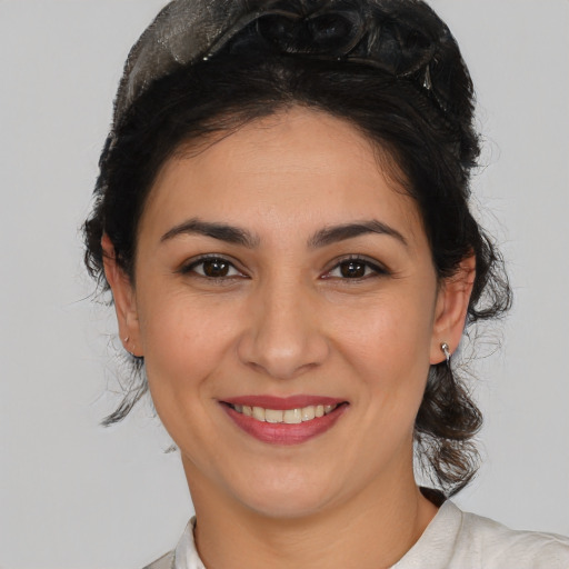 Joyful white young-adult female with medium  brown hair and brown eyes