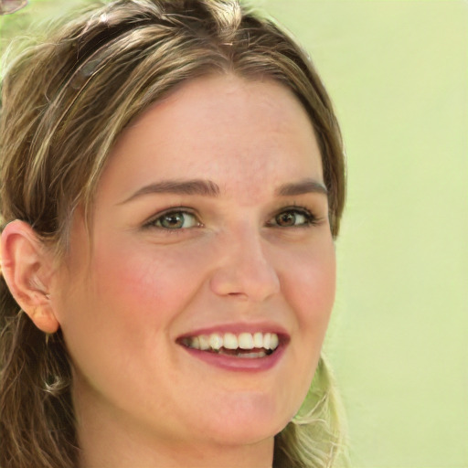 Joyful white young-adult female with long  brown hair and green eyes