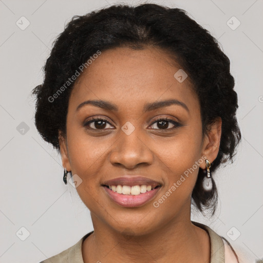 Joyful black young-adult female with long  black hair and brown eyes