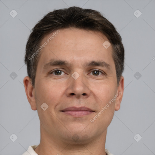 Joyful white adult male with short  brown hair and brown eyes