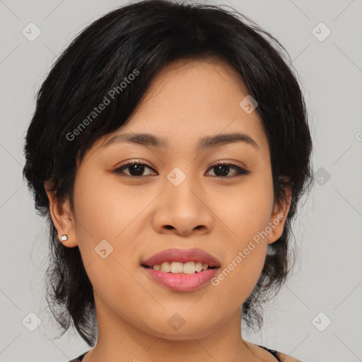 Joyful asian young-adult female with medium  black hair and brown eyes