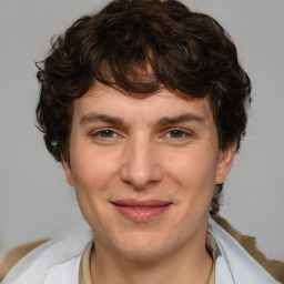 Joyful white adult male with medium  brown hair and brown eyes