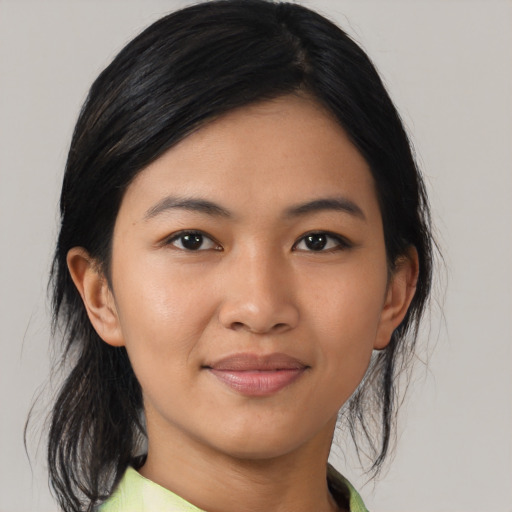 Joyful asian young-adult female with medium  black hair and brown eyes