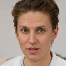 Joyful white adult female with short  brown hair and brown eyes