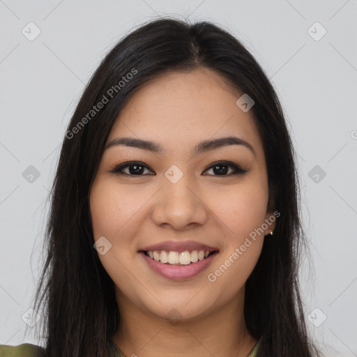 Joyful latino young-adult female with long  brown hair and brown eyes