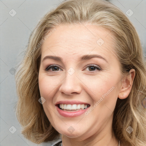 Joyful white adult female with long  brown hair and brown eyes