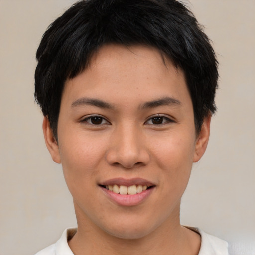 Joyful asian young-adult female with short  brown hair and brown eyes