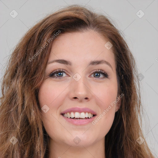 Joyful white young-adult female with long  brown hair and green eyes