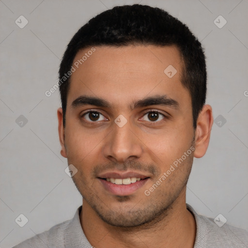 Joyful white young-adult male with short  black hair and brown eyes