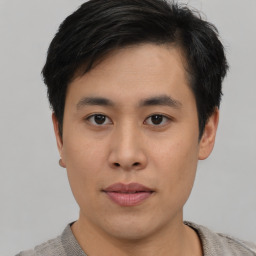 Neutral asian young-adult male with short  brown hair and brown eyes