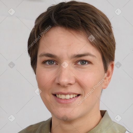 Joyful white young-adult female with short  brown hair and grey eyes