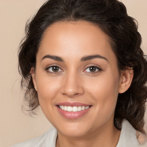 Joyful white young-adult female with medium  brown hair and brown eyes