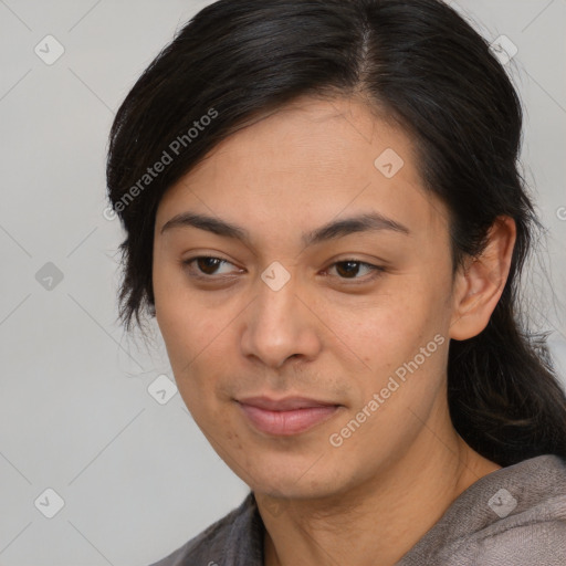 Joyful asian young-adult female with medium  black hair and brown eyes