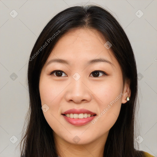 Joyful asian young-adult female with long  brown hair and brown eyes