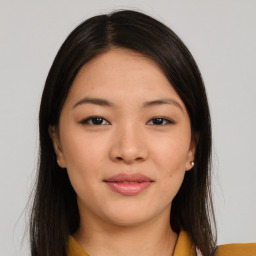 Joyful asian young-adult female with long  brown hair and brown eyes