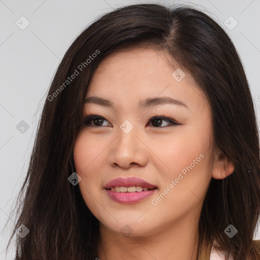 Joyful asian young-adult female with long  brown hair and brown eyes