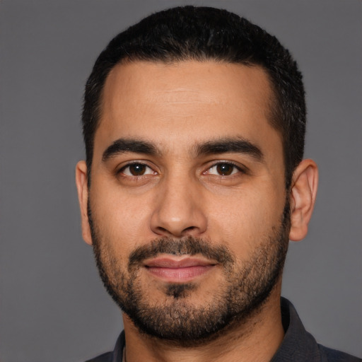 Neutral latino young-adult male with short  black hair and brown eyes