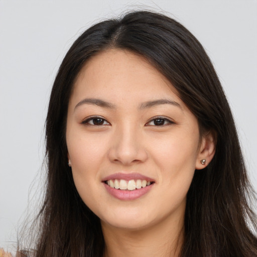 Joyful white young-adult female with long  brown hair and brown eyes
