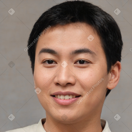 Joyful asian young-adult male with short  brown hair and brown eyes