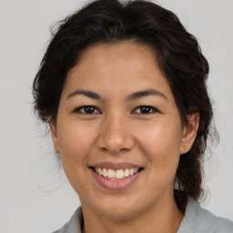 Joyful asian young-adult female with medium  brown hair and brown eyes