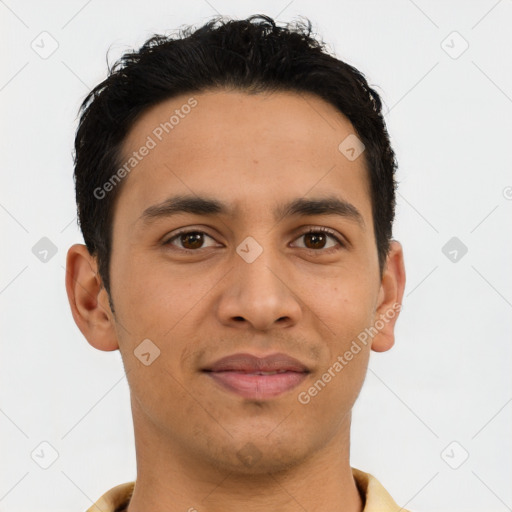 Joyful latino young-adult male with short  brown hair and brown eyes