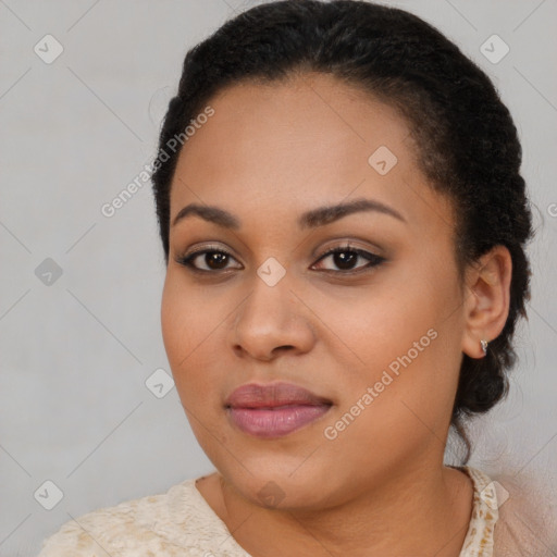 Joyful black young-adult female with medium  brown hair and brown eyes