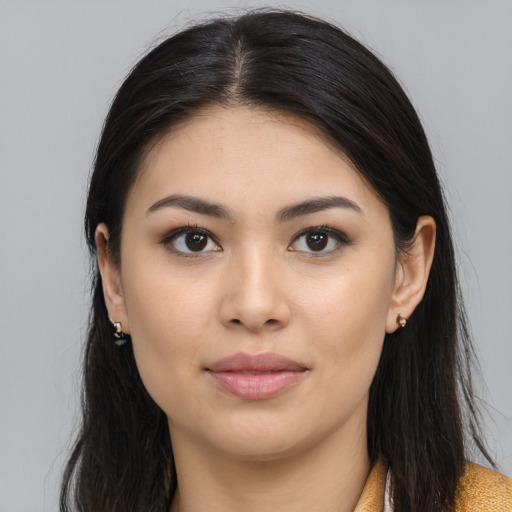 Joyful white young-adult female with long  brown hair and brown eyes