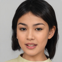 Joyful asian young-adult female with medium  black hair and brown eyes