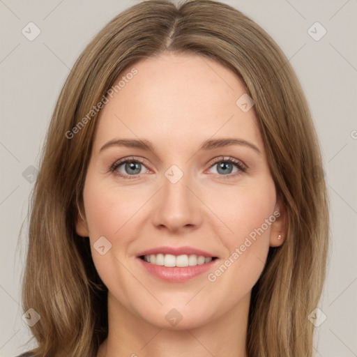 Joyful white young-adult female with medium  brown hair and green eyes