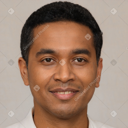 Joyful latino young-adult male with short  black hair and brown eyes