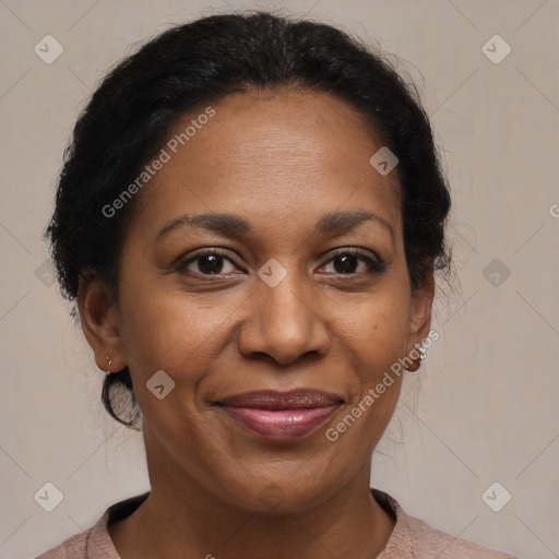 Joyful black adult female with short  brown hair and brown eyes