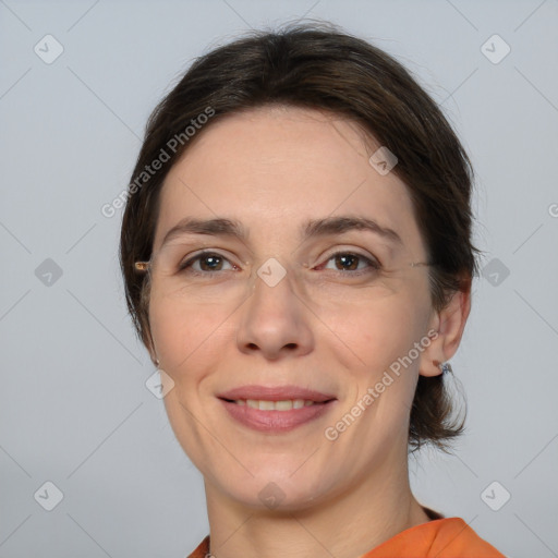 Joyful white adult female with medium  brown hair and brown eyes