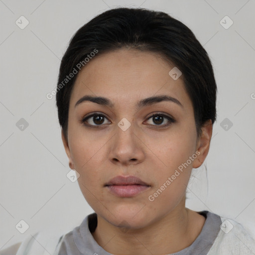 Neutral white young-adult female with short  black hair and brown eyes