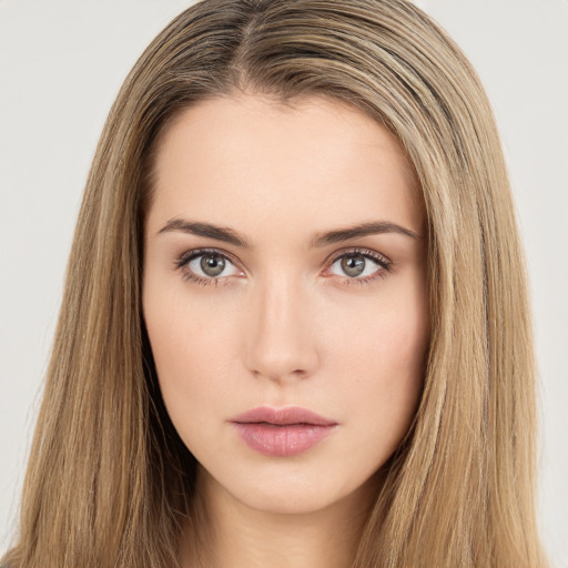 Neutral white young-adult female with long  brown hair and brown eyes