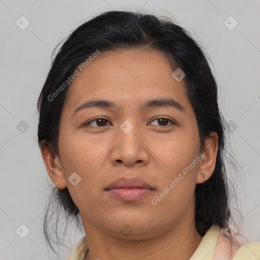 Neutral asian adult female with medium  brown hair and brown eyes