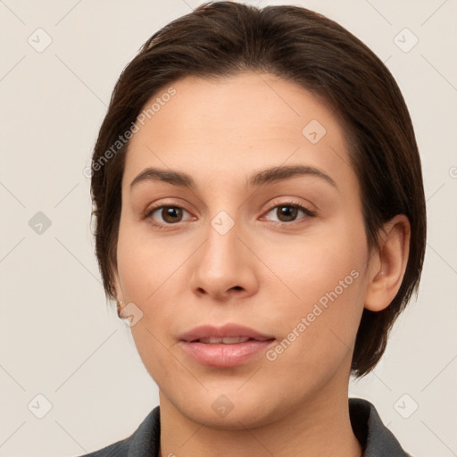 Neutral white young-adult female with medium  brown hair and brown eyes