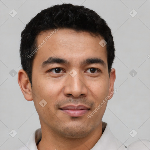 Joyful latino young-adult male with short  black hair and brown eyes