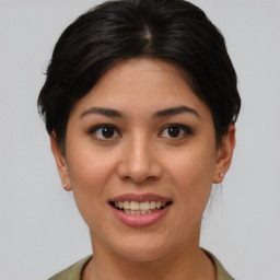 Joyful asian young-adult female with short  brown hair and brown eyes