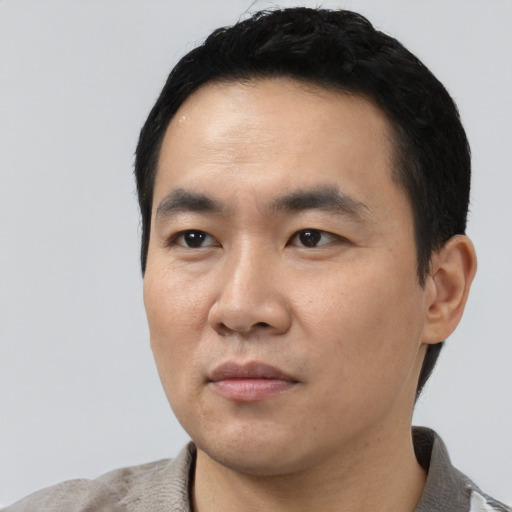 Neutral asian young-adult male with short  black hair and brown eyes