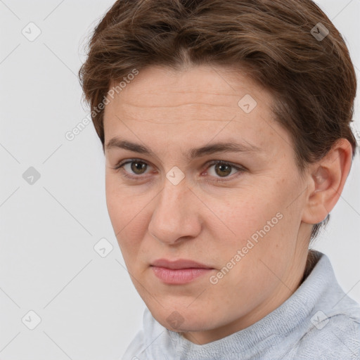 Joyful white adult female with short  brown hair and grey eyes