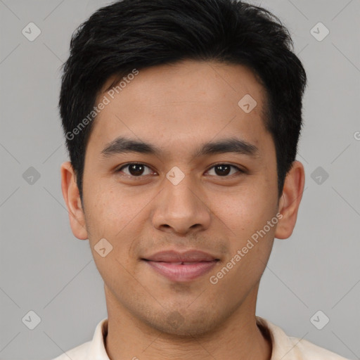 Joyful asian young-adult male with short  black hair and brown eyes