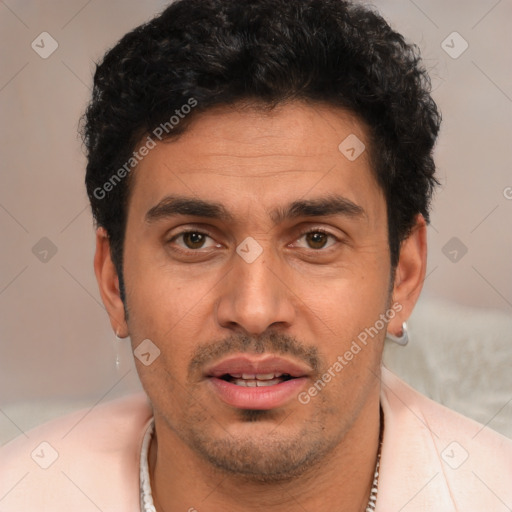 Joyful white young-adult male with short  black hair and brown eyes