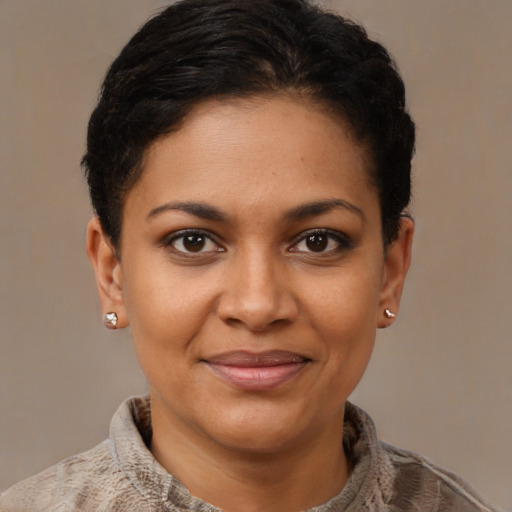 Joyful black young-adult female with short  brown hair and brown eyes