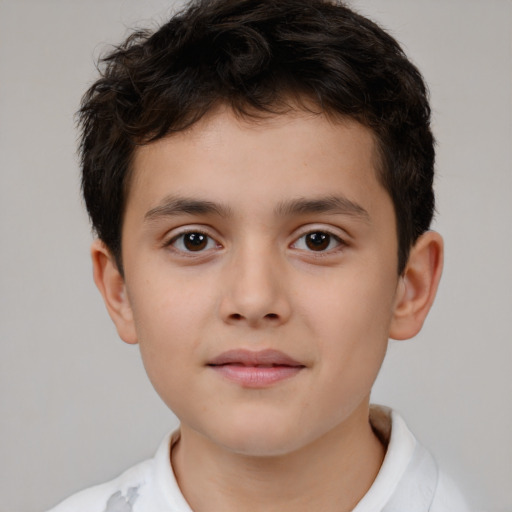Joyful white child male with short  brown hair and brown eyes