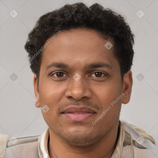 Joyful black young-adult male with short  brown hair and brown eyes
