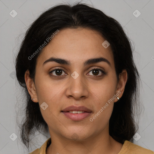 Joyful latino young-adult female with medium  brown hair and brown eyes