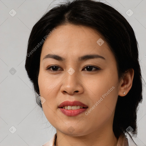 Joyful asian young-adult female with medium  black hair and brown eyes