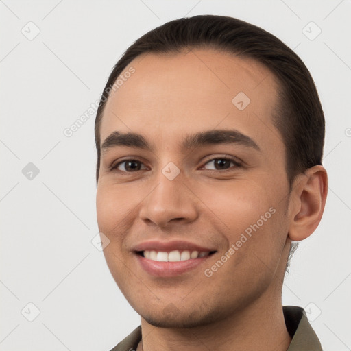 Joyful white young-adult male with short  brown hair and brown eyes