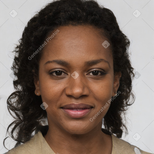 Joyful black young-adult female with long  brown hair and brown eyes